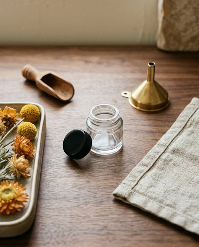 5ml Screw Top Jar with Black Lids — workspace flatlay