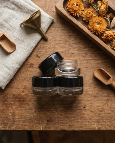9ml Round Bottom Child Resistant Glass Jar with Lids — workspace flatlay