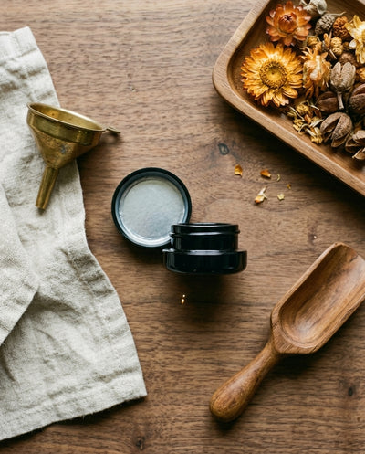 7ml UV Resistant Round Bottom Jar with Child Resistant Black Lids — workspace flatlay