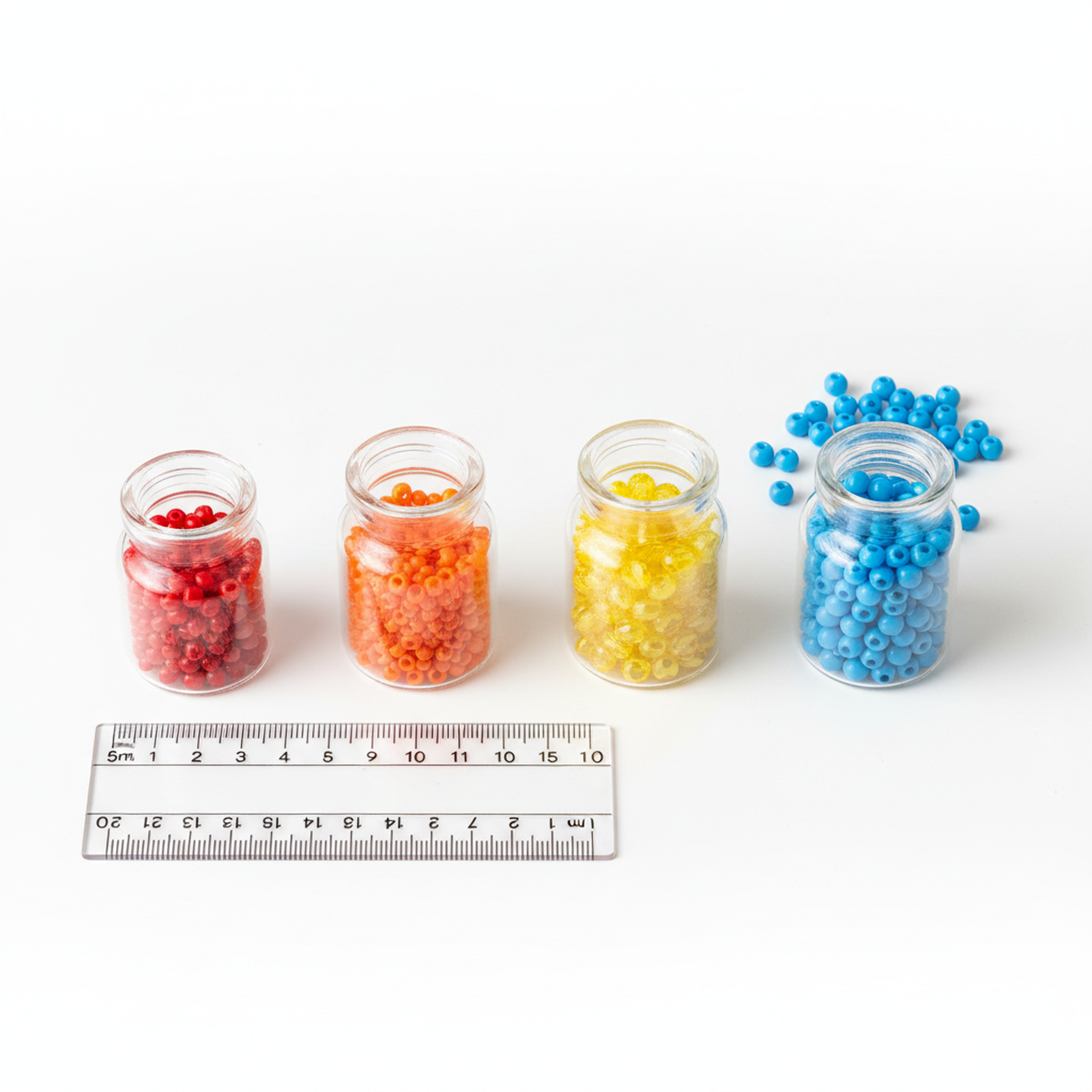Four small glass jars showing size comparison from 5ml to 9ml