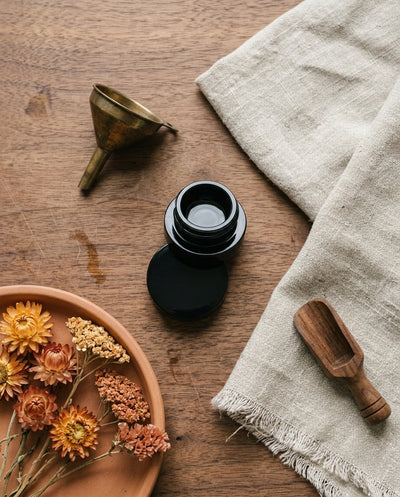 5ml UV Resistant Round Bottom Jar with Child Resistant Black Lids — workspace flatlay